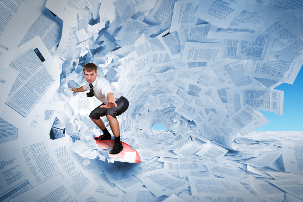 Confident surfer riding the barrel of documents wave