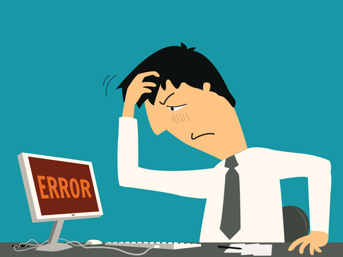 Businessman confused and being in bad temper with error message on computer.