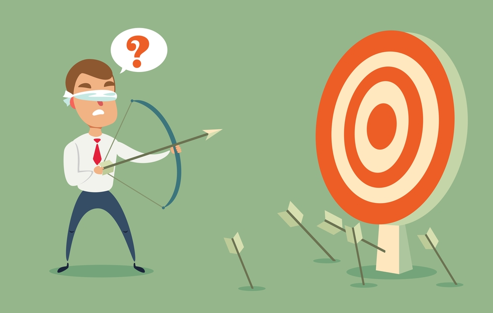 Blindfolded businessman shooting arrow. Blindfolded businessman shooting arrow. Missed the target.